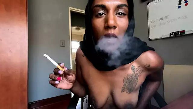 Desi in hijab smoking while wearing nipple clamps