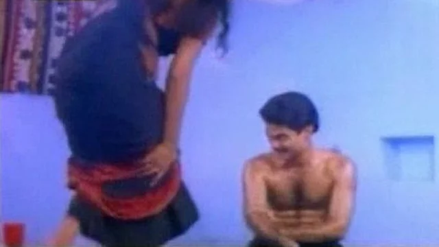 Indian aunty doing oil massage to her husband