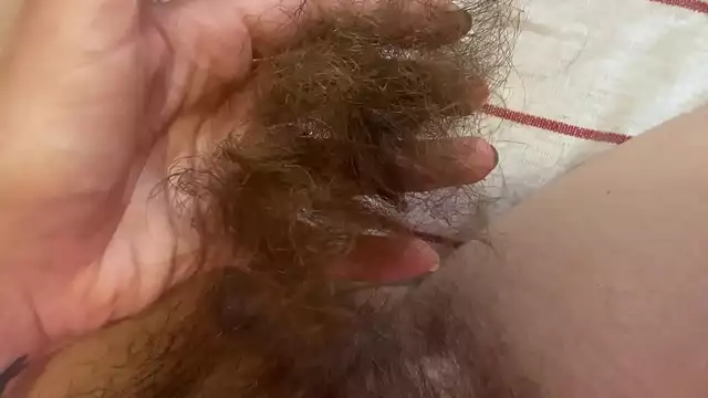 Unleash Your Desires with this Luscious Enchantress's Trimmed Super Long Pussy Hair Close-up!